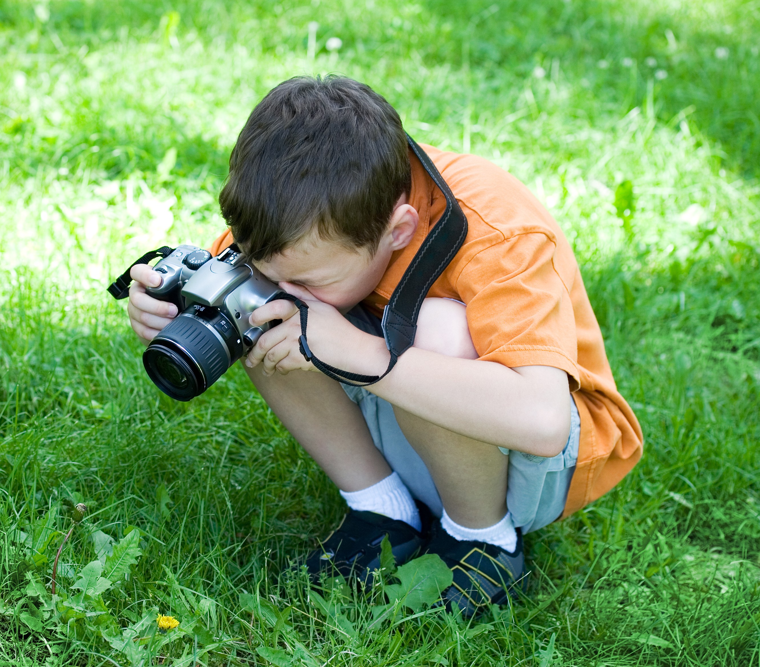 Child taking a photograph